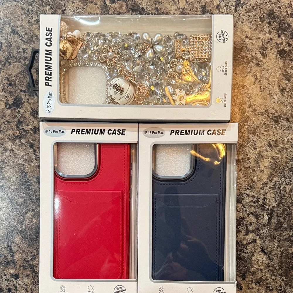 #94 Red and Blue IPhone 16 Pro Max and a Bling out 16 Pro Max Cover.